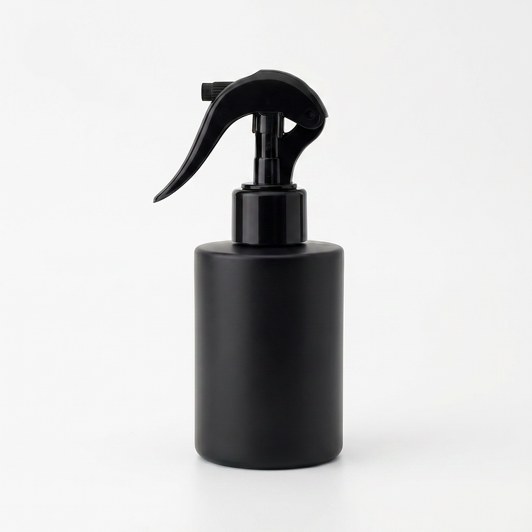 4 oz. Frosted Round Glass Bottle a Spray Top/Mister on a white background
