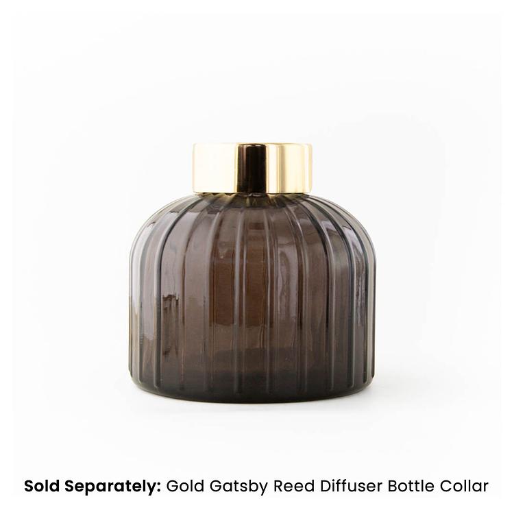 Smoked Gatsby Reed Diffuser Bottle on a white background with a Gold Gatsby Collar
