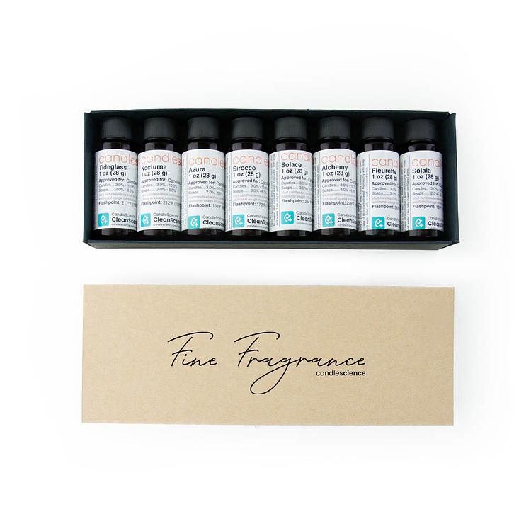 A Fine Fragrance Sampler Box completely opened to reveal 1 oz bottles on a white background