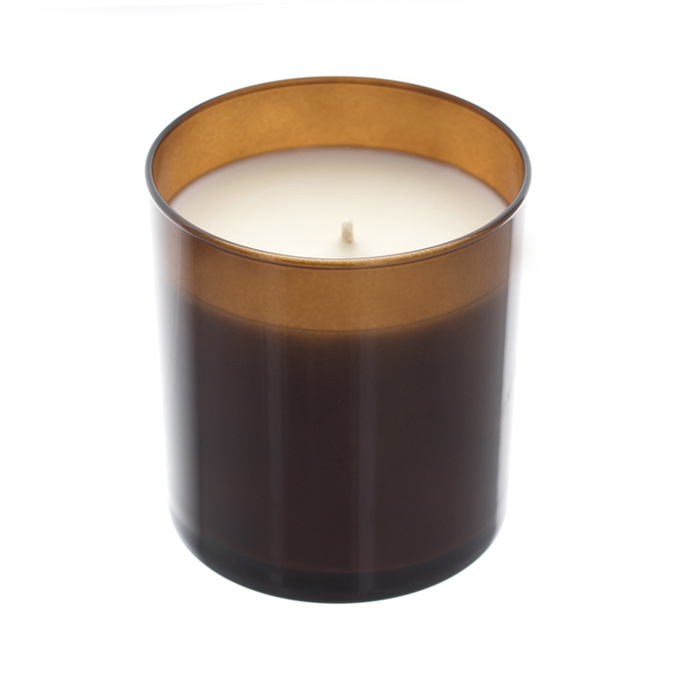 Amber straight sided tumbler jar with soy wax inside