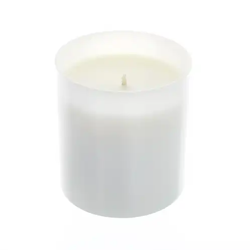 white tumbler jar with candle wax inside