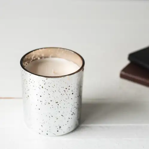 Silver Mercury Tumbler Jar Candle on white counter top