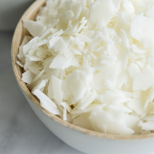 Premium Photo  Close up of white soy wax flakes for candle making in a  ceramic bowl