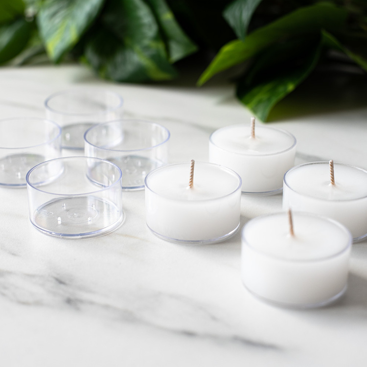 Clear Plastic Tealights with candles and leafy background