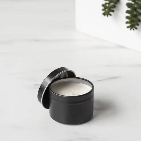 2 oz Black Candle Tin with Planter in Background