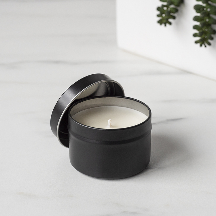4 oz Black Candle Tin with Planter in Background