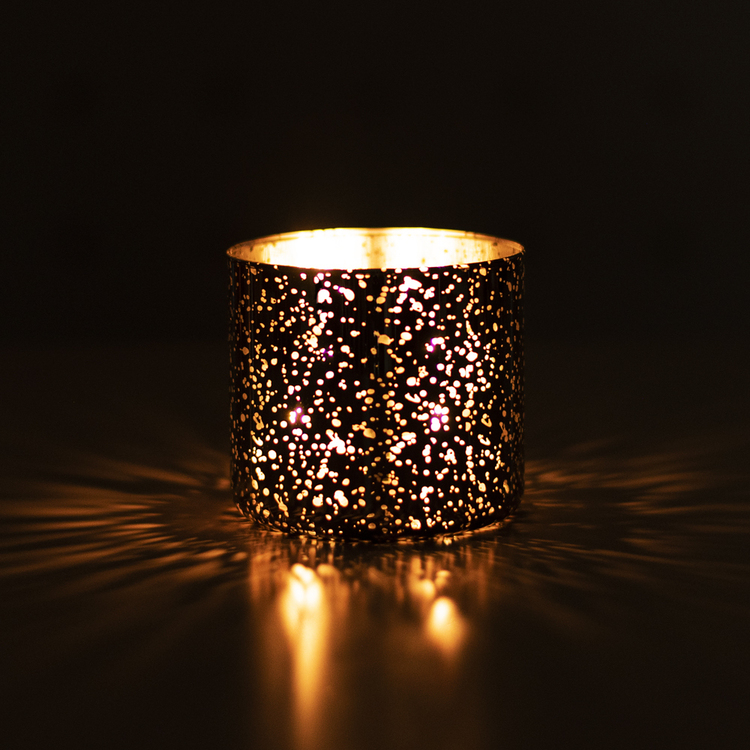 Mercury 3-Wick Tumbler in the dark with a lit candle