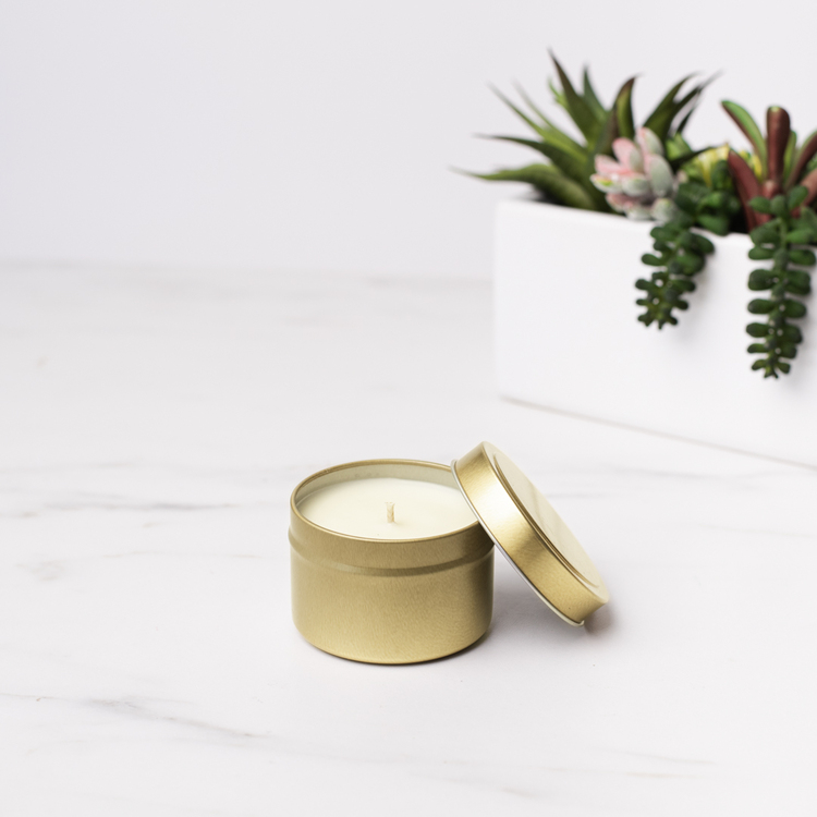 4 oz Gold Candle Tin with Planter in Background