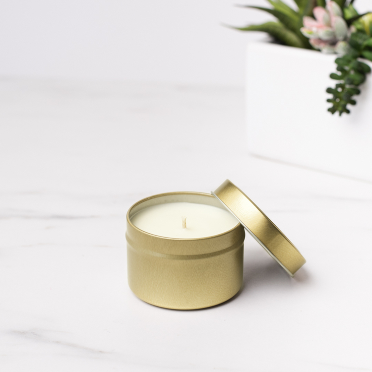 6 oz Gold Candle Tin with Planter in Background