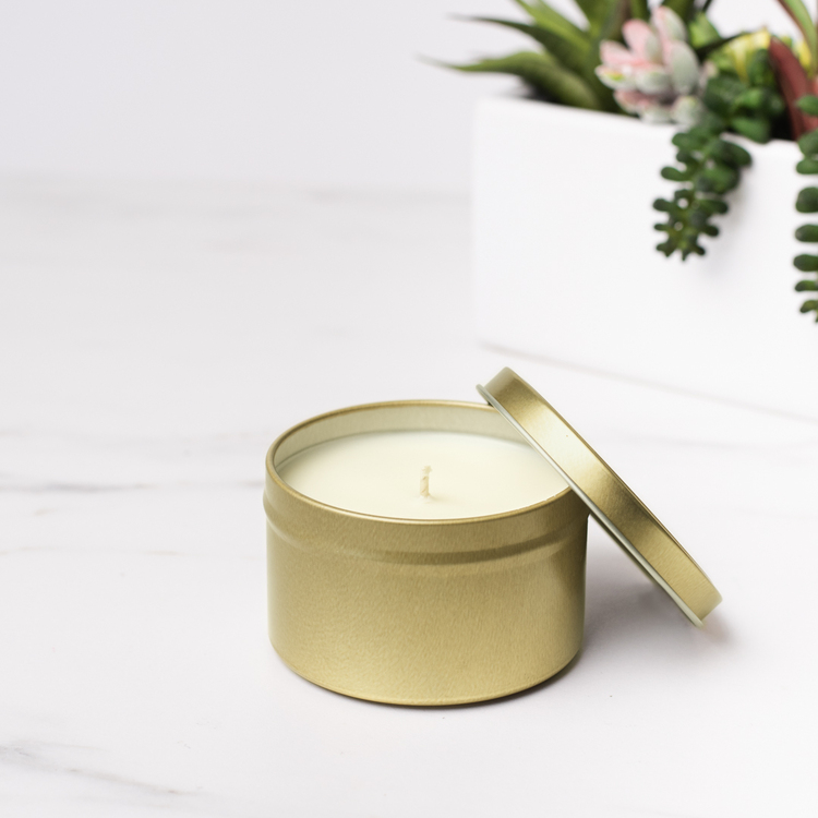 8 oz Gold Candle Tin with Planter in Background