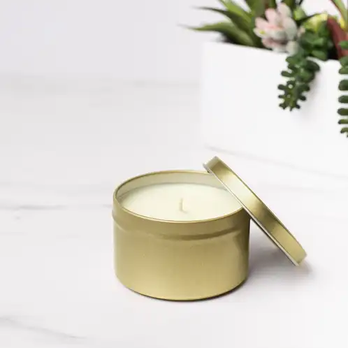 8 oz Gold Candle Tin with Planter in Background