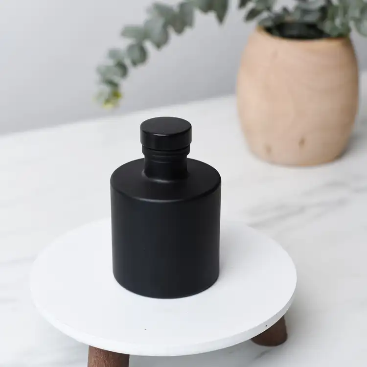 Matte Black Round Reed Diffuser Bottle with Matte Black Stopper and Plant