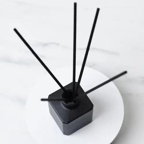 Black Fiber Diffuser Reeds with Matte Black Cube Diffuser Bottle Looking Down