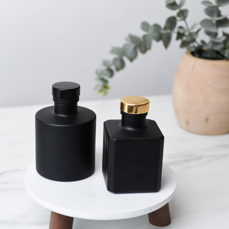 Gold Round Bottle Stopper with Matte Black Round and Cube Diffuser Bottles