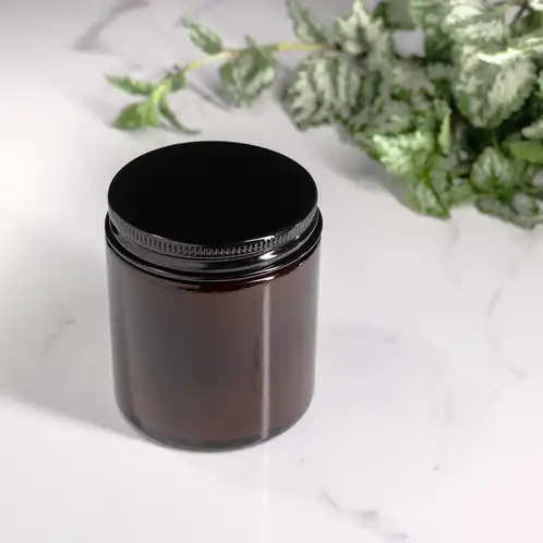 Small Amber Straight Sided Jar (Threaded) filled with candle and black lid