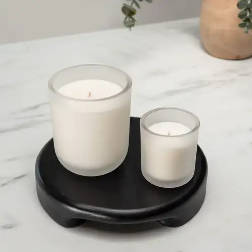 Frosted Sonoma Tumbler Jar with a Mini Frosted Sonoma Tumbler Jar on a black stand. 