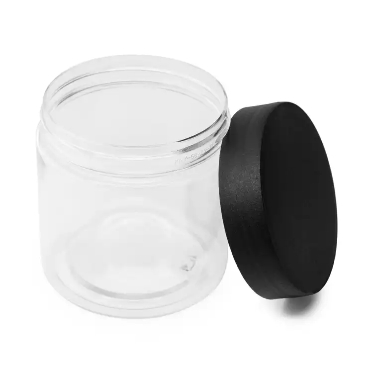 8 oz. Clear Single Wall PET Jar with Matte Black Lid with lid on its side
