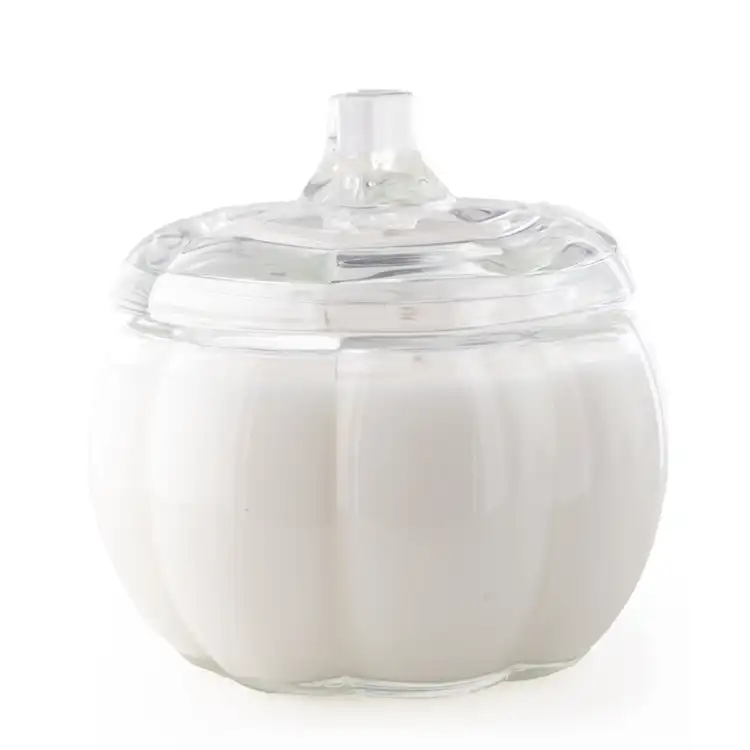 Clear Pumpkin Jar filled with white candle. A clear stem lid finishes the candle.