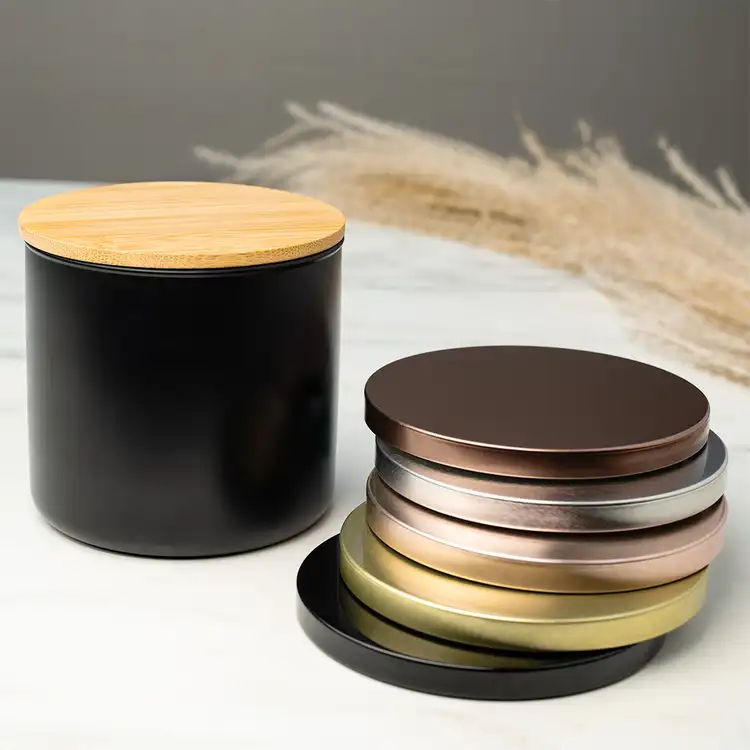 Matte Black 3-Wick Tumbler Jar with 4" Bamboo Lid beside Metal Flat Lids (3-Wick)