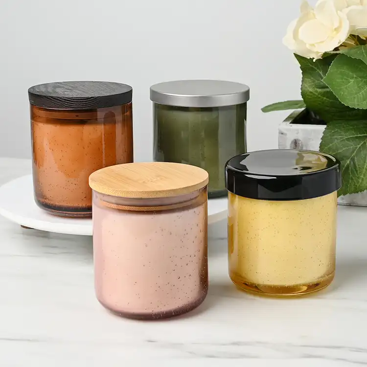 Collection of Bubble Tumbler Jar candles with assorted lids