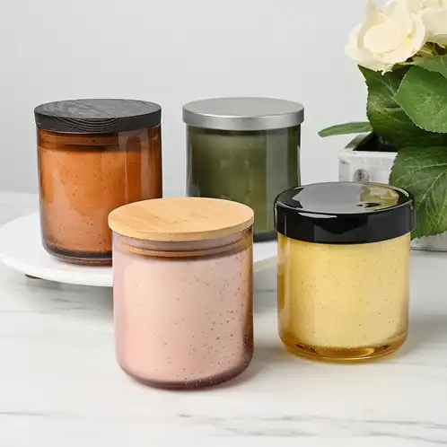 Collection of Bubble Tumbler Jar candles with assorted lids