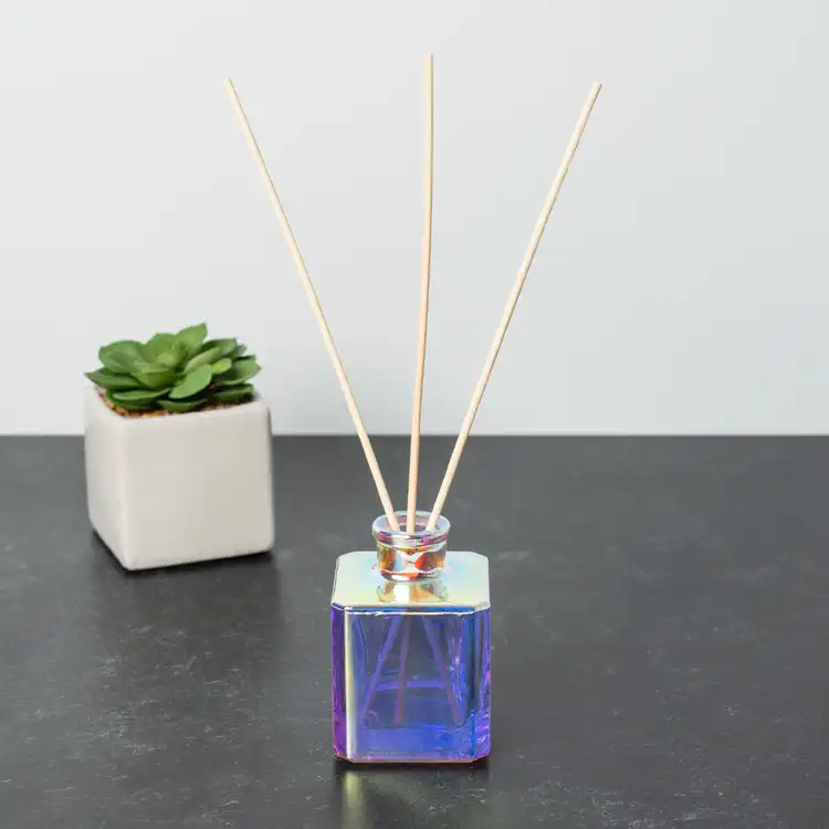 Prism Cube Reed Diffuser Bottle with Natural Diffuser Reeds on black table