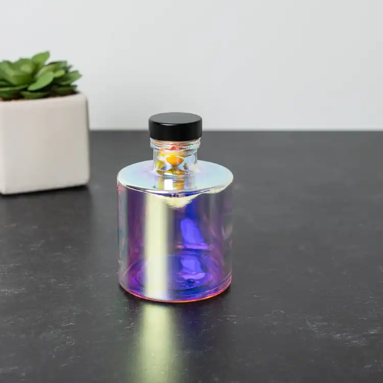 Prism Round Reed Diffuser Bottle with Matte Black Bottle Stopper on black table