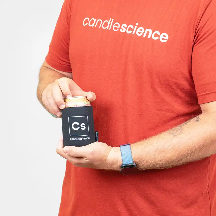 CandleScience Koozie on can, held in front of torso