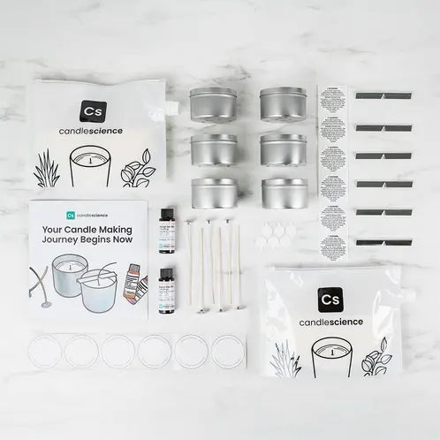 Candle Making Starter Kit displaying individual box contents on white marble table