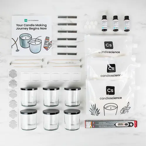 Starter+ Candle Making Kit contents looking down from the top displayed on a white marble countertop