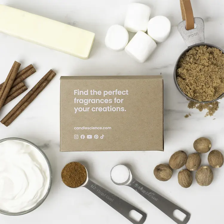 Baking Memories Bright Fragrance Flight box with baking ingredients around in on a marble countertop