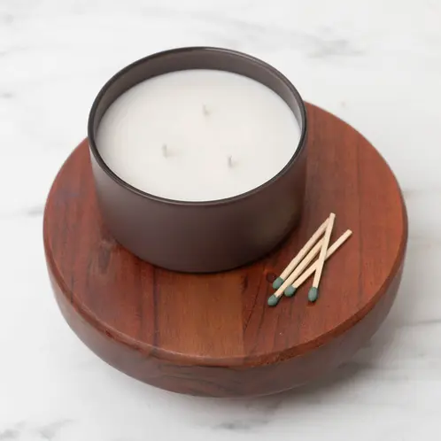 Matte Mocha Calista Tumbler Jar on a wooden riser with matches beside it.