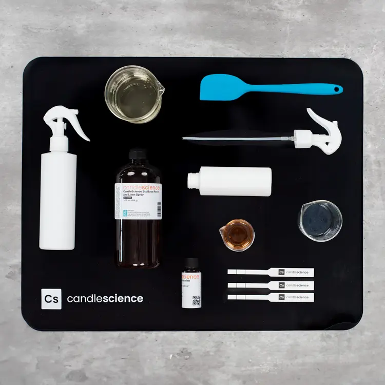 CandleScience Branded Silicone Work Mat with room spray equipment in use
