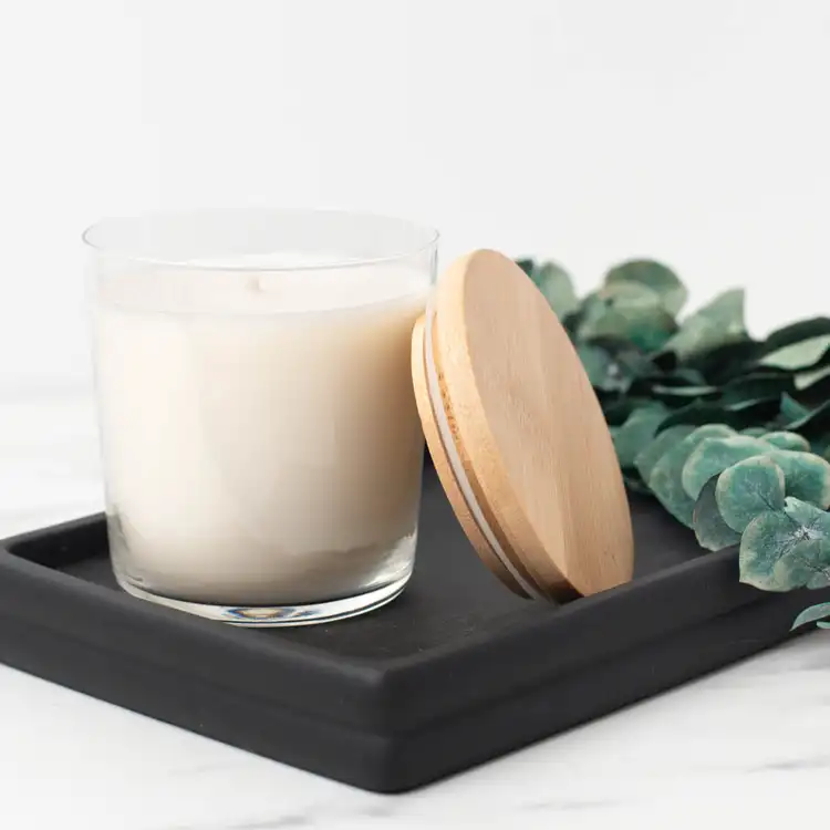 13.25 oz. Cidra Glass Tumbler Jar filled candle on a black tray