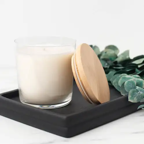 13.25 oz. Cidra Glass Tumbler Jar filled candle on a black tray