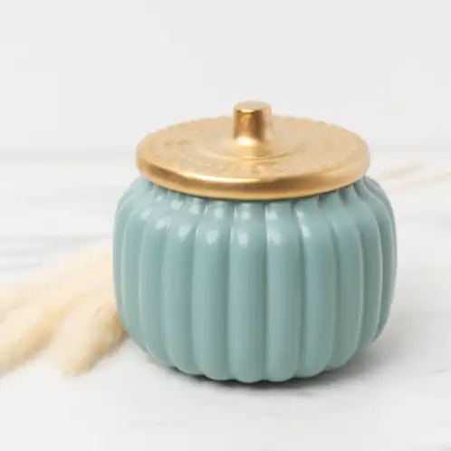 Harvest Teal Ceramic Pumpkin Jar on a marble background with pampas gras