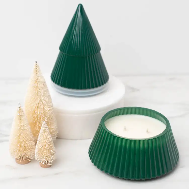 Green Glass Tree Jar on a white pedestal and marble countertop