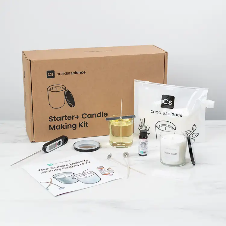 Starter+ Candle Making Kit with box and contents on display on a white marble table