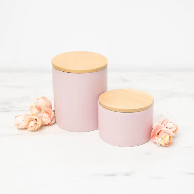 Mini Blush Modern Ceramic Tumbler and Blush Modern Ceramic Tumbler on a white marble background with decorative rosebuds on the counter.