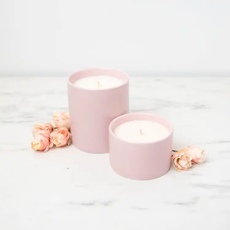 Mini Blush Modern Ceramic Tumbler and Blush Modern Ceramic Tumbler on a white marble background with decorative rosebuds on the counter.