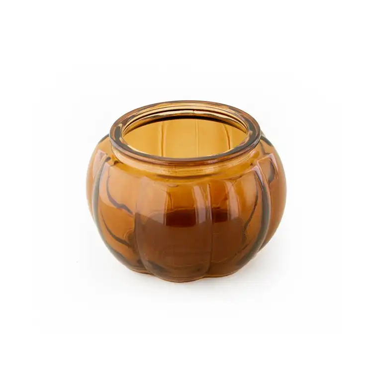 Mini Amber Glass Pumpkin Jar without a lid on a white background