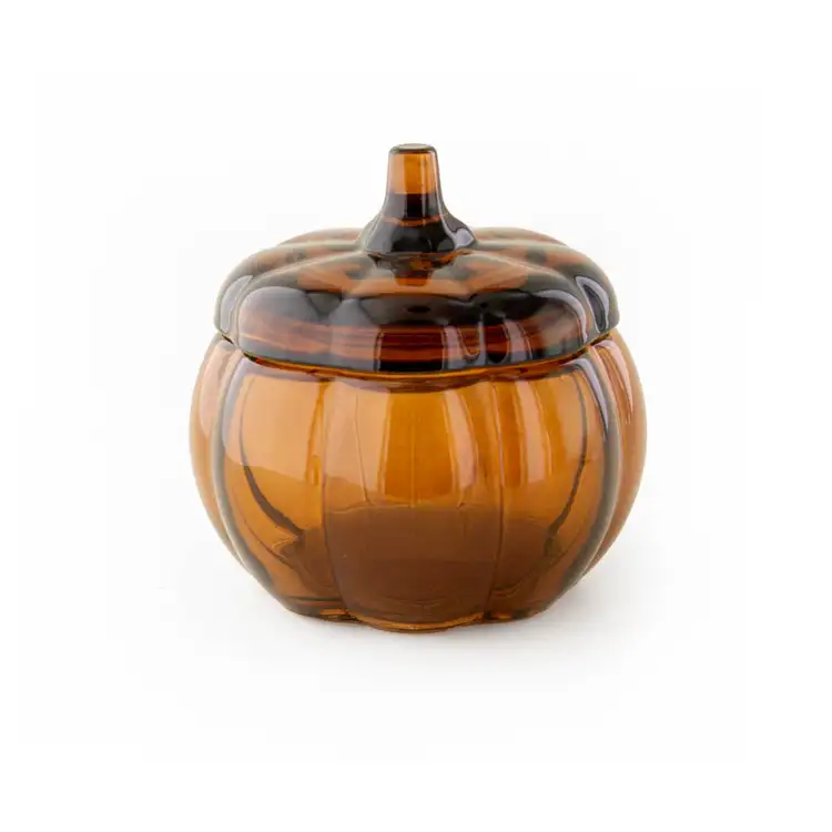 Mini Amber Glass Pumpkin Jar with a lid on a white background