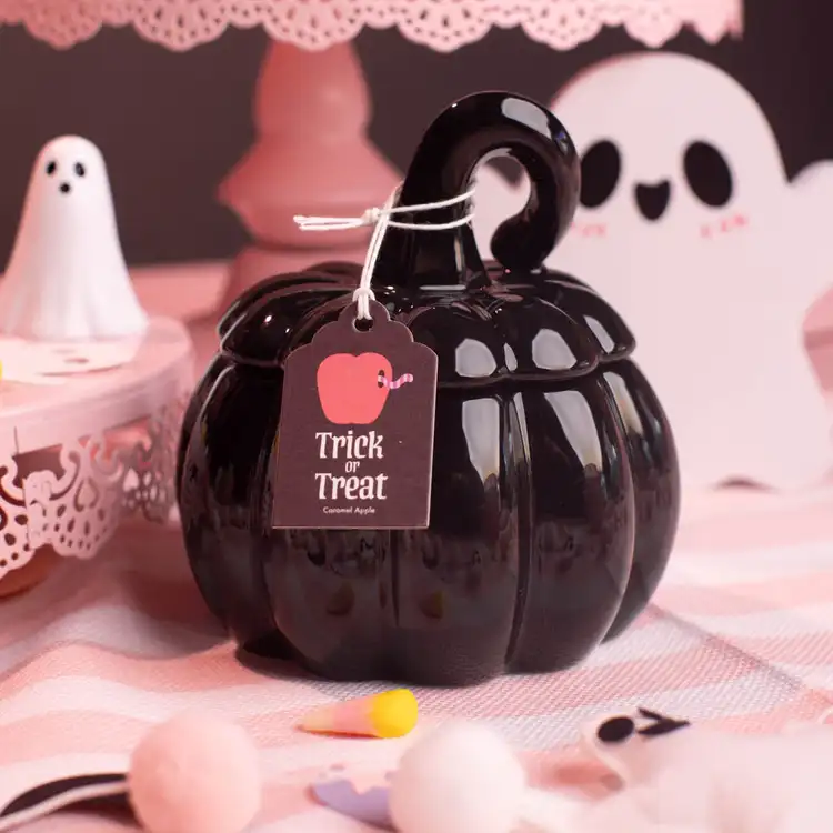 Black Ceramic Stemmed Pumpkin Jar with a black hang tag