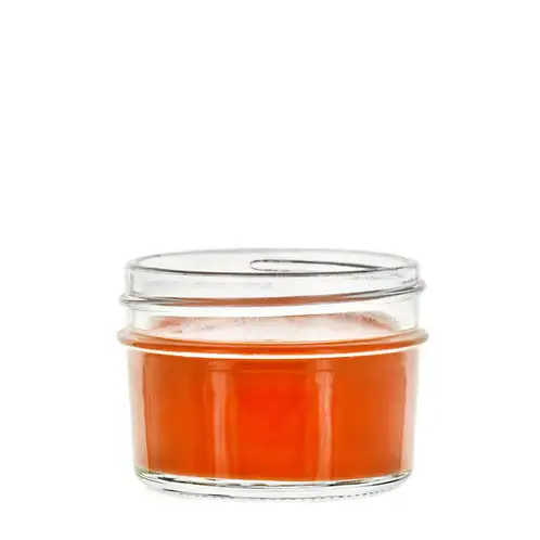 4 oz. glass jelly jar with candle wax inside