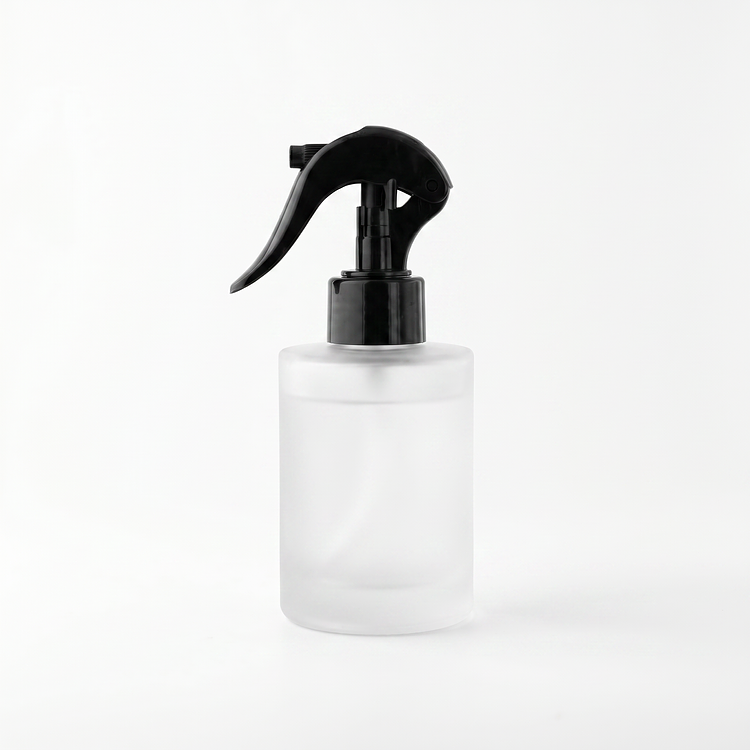 4 oz. Frosted Round Glass Bottle a Spray Top/Mister on a white background