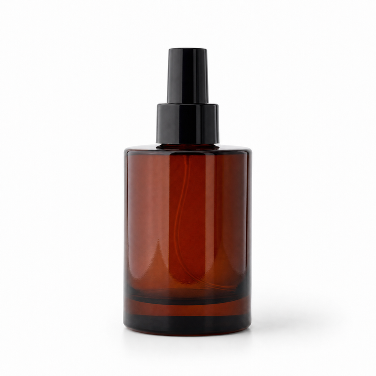 4 oz. Amber Round Glass Bottle a Black Cap on a white background